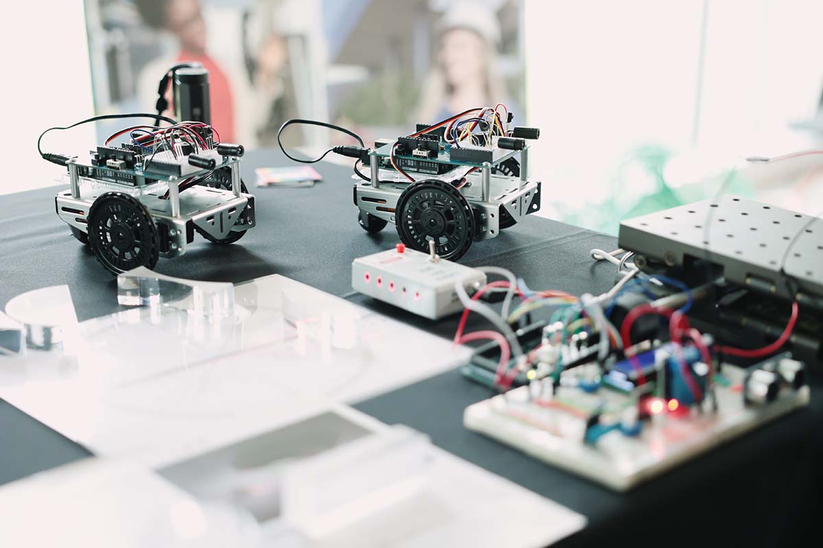 A technical device featuring toy cars